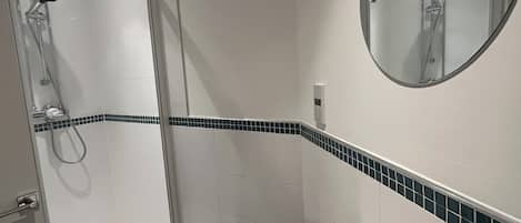 Shower, hair dryer, towels, soap