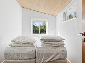 A room with a bed, a window, and a door. - "Swea" - 2.5km from the sea by Interhome (Højby)