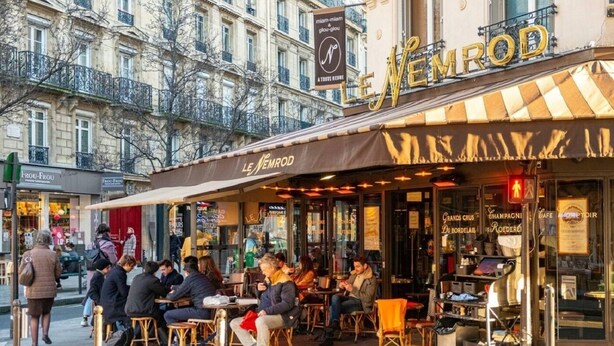A café with outdoor seating, a sign reading 'Le Némrod,' and a building with balconies in the background. - A REFINED & COMFORTABLE BASE IN D MOST CAPTIVATING NEIGHBOURHOODS-SAINT GERMAIN (Paris)