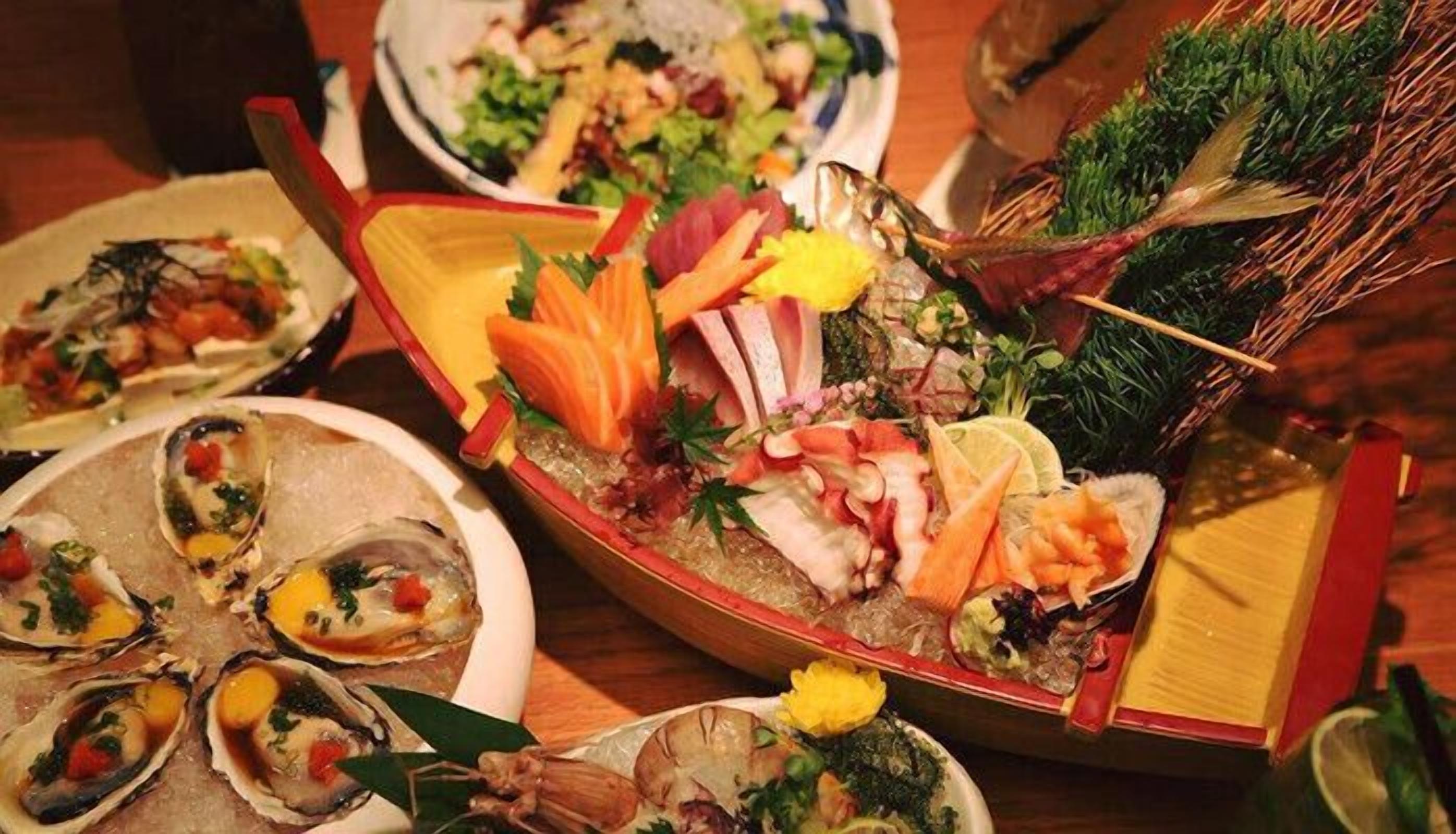 A variety of seafood dishes arranged on a table.