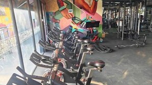 A gym with stationary bikes, weight machines, and a mural on the wall. - GL Luxe Suites 2-bedroom apartment in Tatu City (Tatu City)