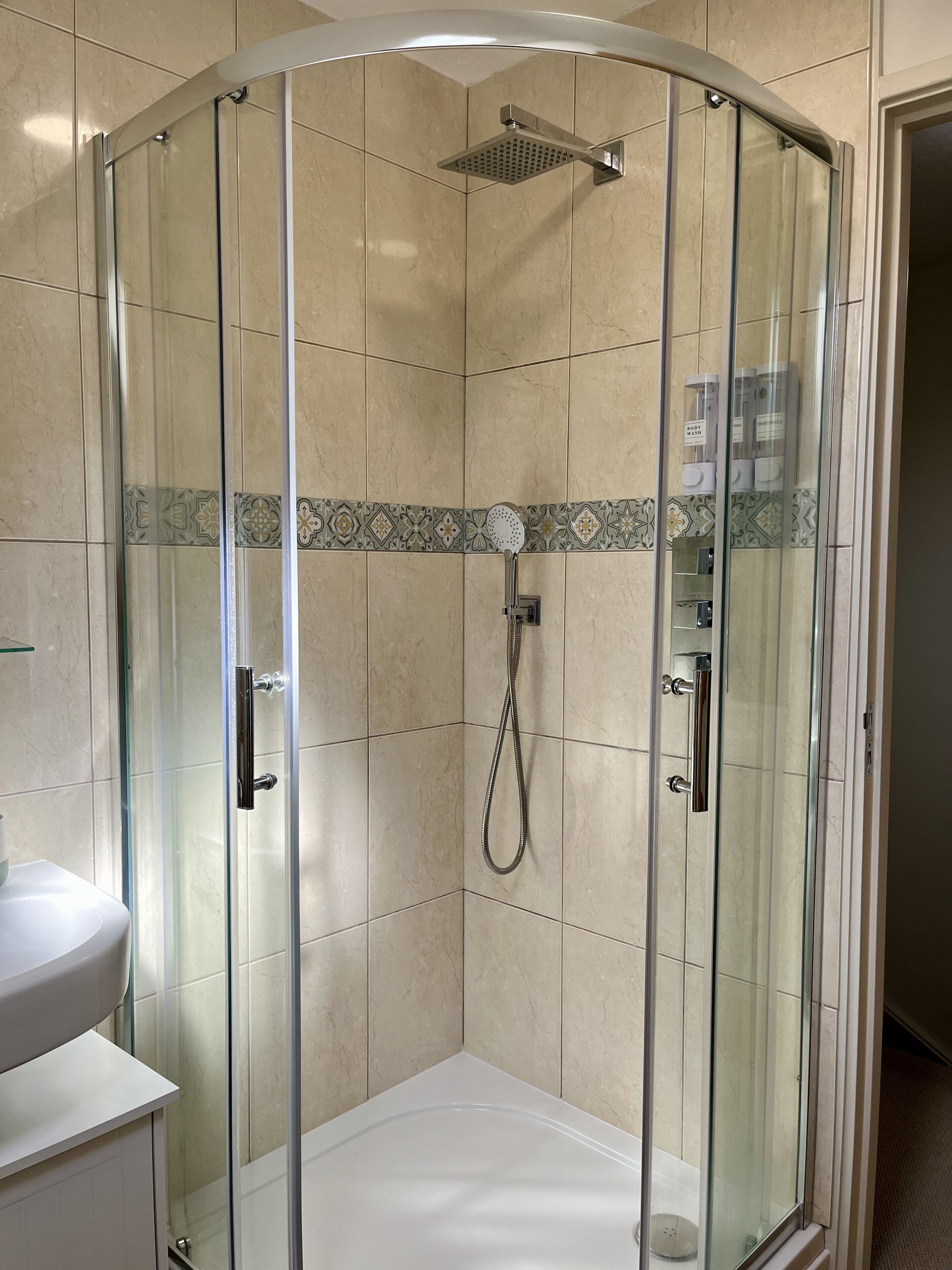 Shower, hair dryer, towels, soap