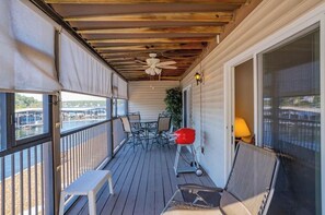 Outdoor dining - 2BR Lakefront End Unit Condo! Large Deck w/ GREAT channel views! (Osage Beach)