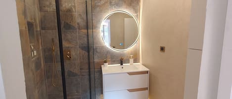 Shower, towels, soap, toilet paper