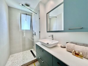 Shower, hair dryer, towels, soap