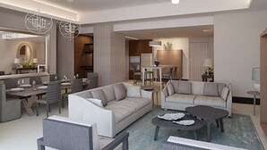 Uma sala de estar moderna com sofá, mesa de centro e área de jantar.