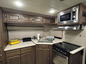 Private kitchen - One Grand Place: Cozy RV - Private Waterfront, Relaxing, Amazing Sunsets (Grand Haven)