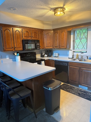 Coffee/tea maker, fridge, microwave, oven