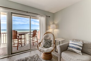 Living area - Ocean front condo w/ multiple pools in beautiful Kure Beach! (Kure Beach)