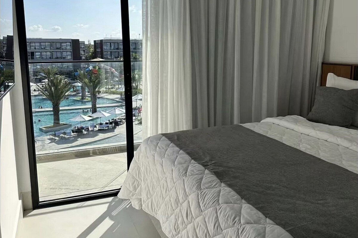 One-Bedroom Apartment with Balcony and Pools Views | Premium bedding, minibar, laptop workspace, cribs (free)