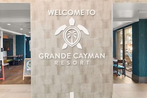 A sign for Grande Cayman Resort with a turtle logo. - Relaxing 3B at Grand Cayman,Modern Decor with Pool (Myrtle Beach)