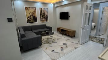 Standard Apartment | Living area | 105-inch LED TV with digital channels, heated floors