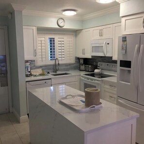 Fridge, microwave, oven, stovetop - Beachfront 2-bedroom  2-bath upper level condo in charming Captiva island. (Captiva)