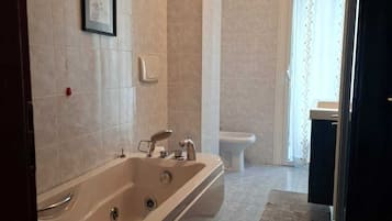 Shower, jetted tub, hair dryer, bidet