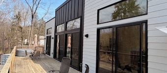 Brand new riverfront home with private beach, modern, serene, central HV spot.