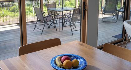 Brand new riverfront home with private beach, modern, serene, central HV spot.