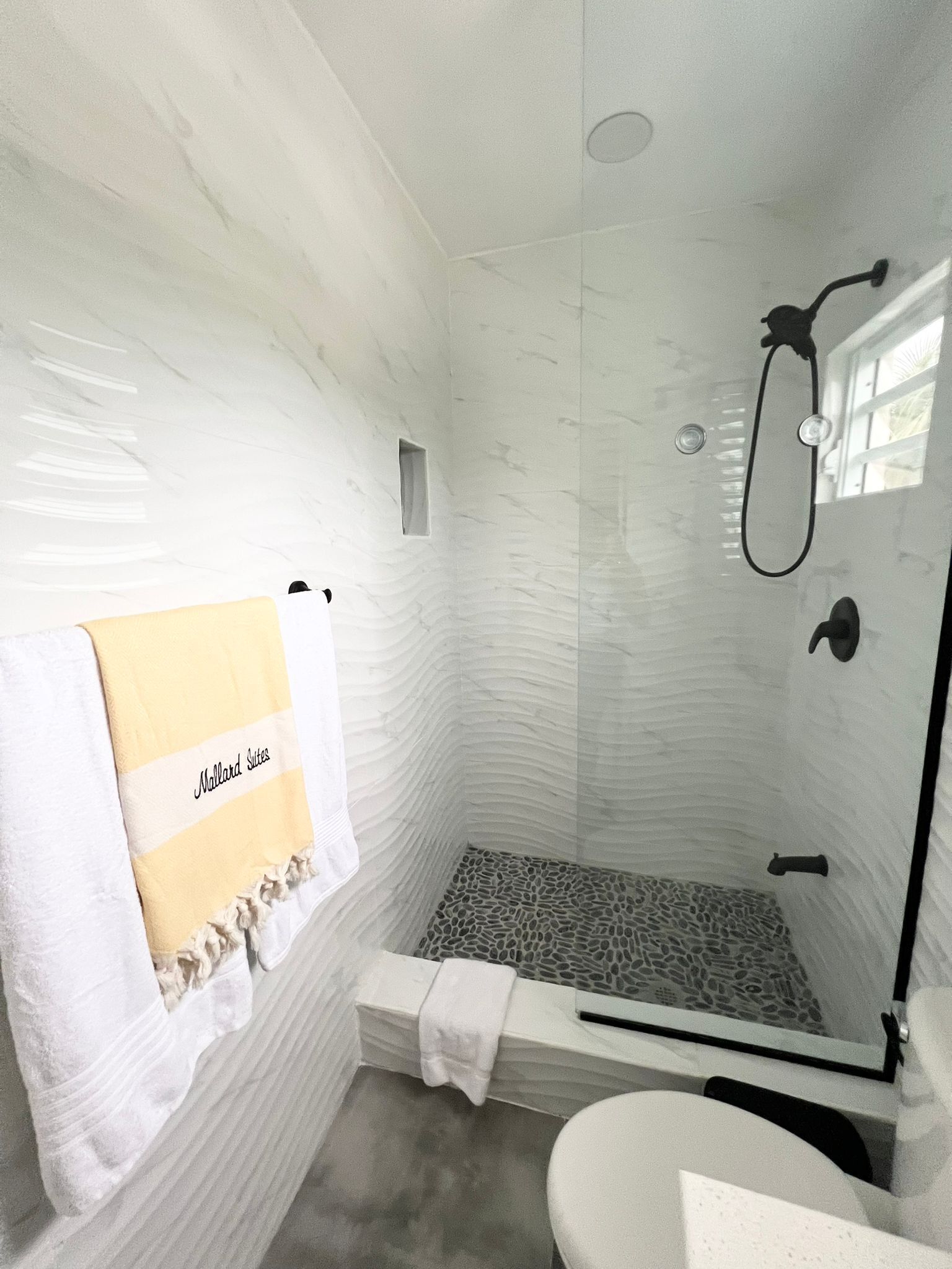 Shower, hair dryer, towels, toilet paper