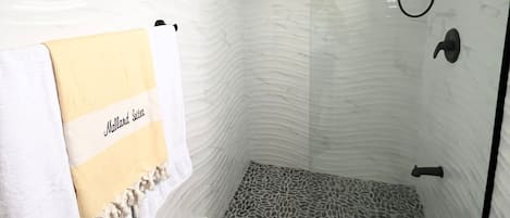 Shower, hair dryer, towels, toilet paper
