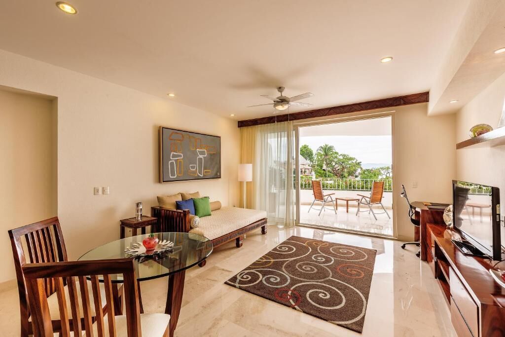 Suite Junior, balkon, pemandangan laut | Area keluarga | Smart TV