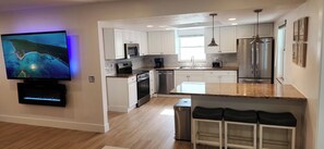 Fridge, microwave, oven, stovetop - Luxe Coastal Retreat • 12 Min to Beach • Private Yard w/Games (Clearwater)