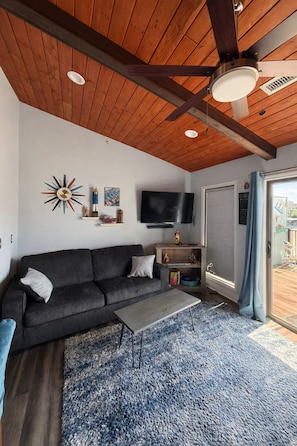 Living area - Lakefront Oasis w/ Balcony Views + Cozy Modern Vibes (Village of Four Seasons)