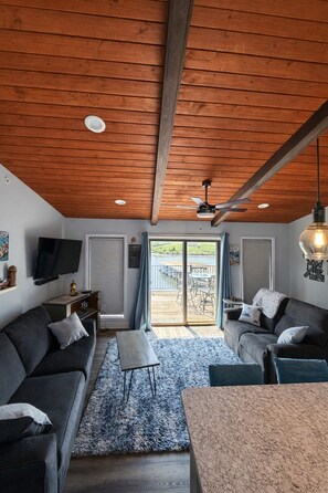 Living area - Lakefront Oasis w/ Balcony Views + Cozy Modern Vibes (Village of Four Seasons)