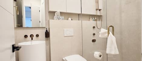 Shower, hair dryer, towels, soap