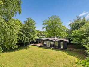 A house with a deck, a small porch, and a yard. - "Niela" - 400m from the sea by Interhome (Kalundborg)