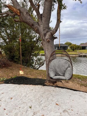 Property grounds - Luxury Canal Villa, Headed Pool, Game Room, Sandy Beach Yard & Fire Pit (Cape Coral)