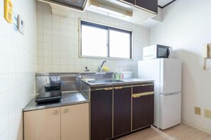 Apartment, Lanai, City View | Private kitchen | Fridge, microwave, stovetop, cookware/dishes/utensils - Rafine Nihonbashi (Osaka)