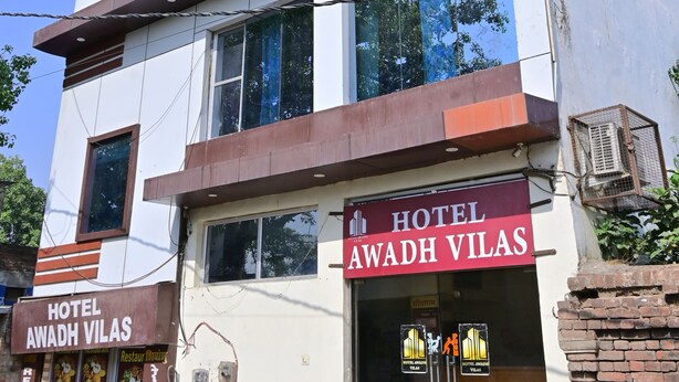 A modern hotel with a prominent sign reading 'HOTEL AWADH VILAS.' - Hotel Awadh Vilas (Ayodhya)
