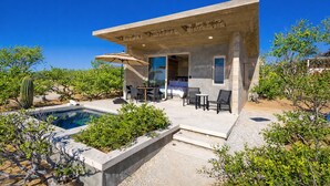 A modern house with a pool, outdoor seating, and a desert garden. - Ocean View Luxury Surf Casita 1    
    IG RanchoAguaSal (Playa Tortuga)