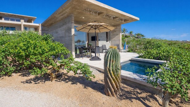 A modern villa with a pool, outdoor seating, and a cactus. - Ocean View Luxury Surf Casita 1    
    IG RanchoAguaSal (Playa Tortuga)