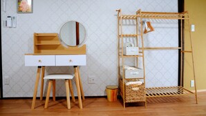 A room with a wooden desk, a mirror, a shelf with storage boxes, and a wooden drying rack. - KAKENKAN (Miyazu)