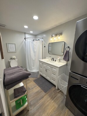Shower, hair dryer, towels, soap
