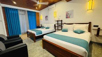 Family Triple Room, Balcony, Mountain View | Desk, laptop workspace, free WiFi