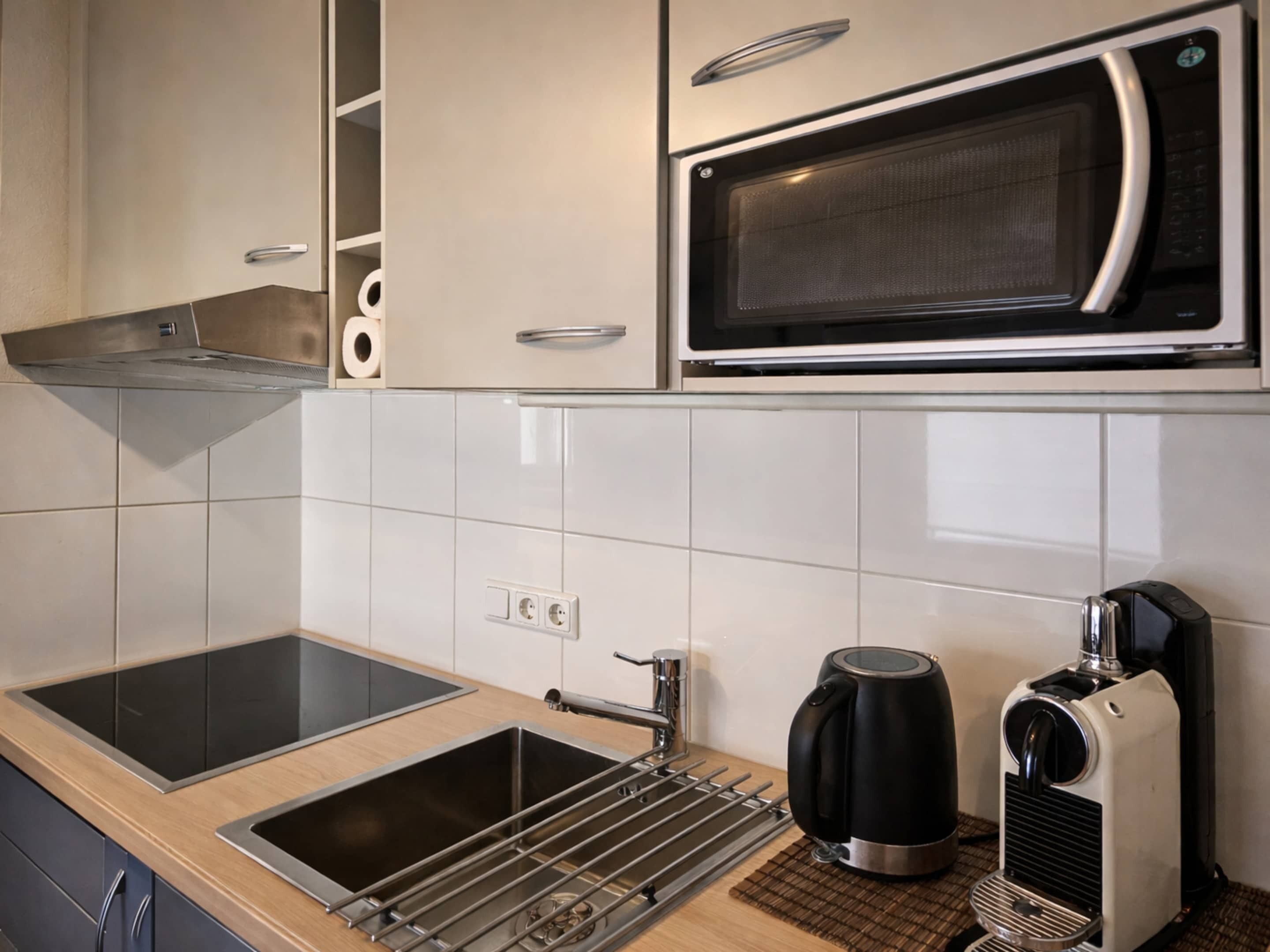 Apartamento clássico, 2 quartos | Cozinha privada | Geladeira, micro-ondas, fogão, lava-louças