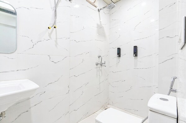 Shower, rainfall showerhead, slippers, towels