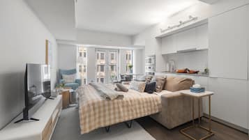 Habitación clásica, 1 cama Queen size y sofá cama | Área de sala de estar | Televisión de pantalla plana de 50 pulgadas con canales digitales