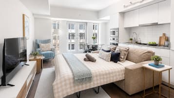 Classic Room, 1 Queen Bed with Sofa bed | Living area | 50-inch flat-screen TV with digital channels