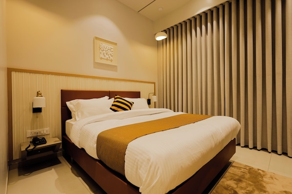 Habitación ejecutiva con 1 cama matrimonial o 2 individuales, vista a la ciudad