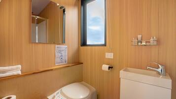 Shower, hair dryer, towels, shampoo