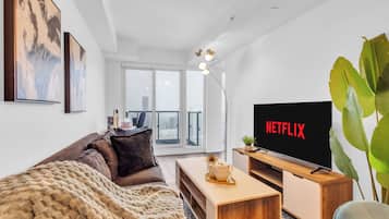 Superior Suite, 3 Bedrooms, 2 Bathrooms, City View | Living area | 50-inch flat-screen TV with digital channels