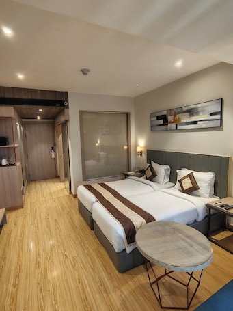 Chambre Deluxe Double ou avec lits jumeaux | Literie de qualité supérieure, minibar, coffres-forts dans les chambres. Orana Hotel and Convention