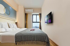 A hotel room with a bed, a television on the wall, an air conditioning unit, and a window with curtains. - SilkStay Apartment Chengdu Kuanzhai Alley (Chengdu)