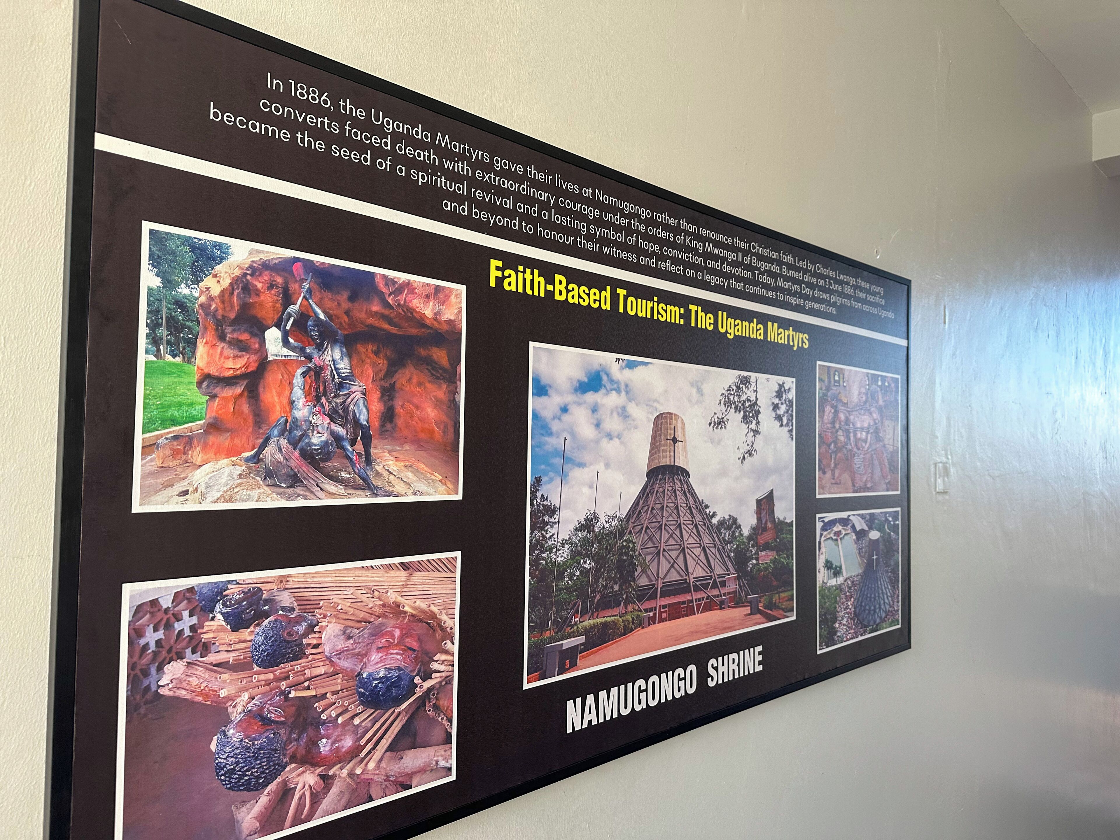 A wall-mounted informational display about the Uganda Martyrs and Namugongo Shrine, featuring historical photos and text.