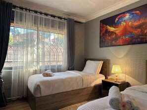 Family Apartment, Housekeeping, Lake View | Desk, laptop workspace, blackout drapes, iron/ironing board