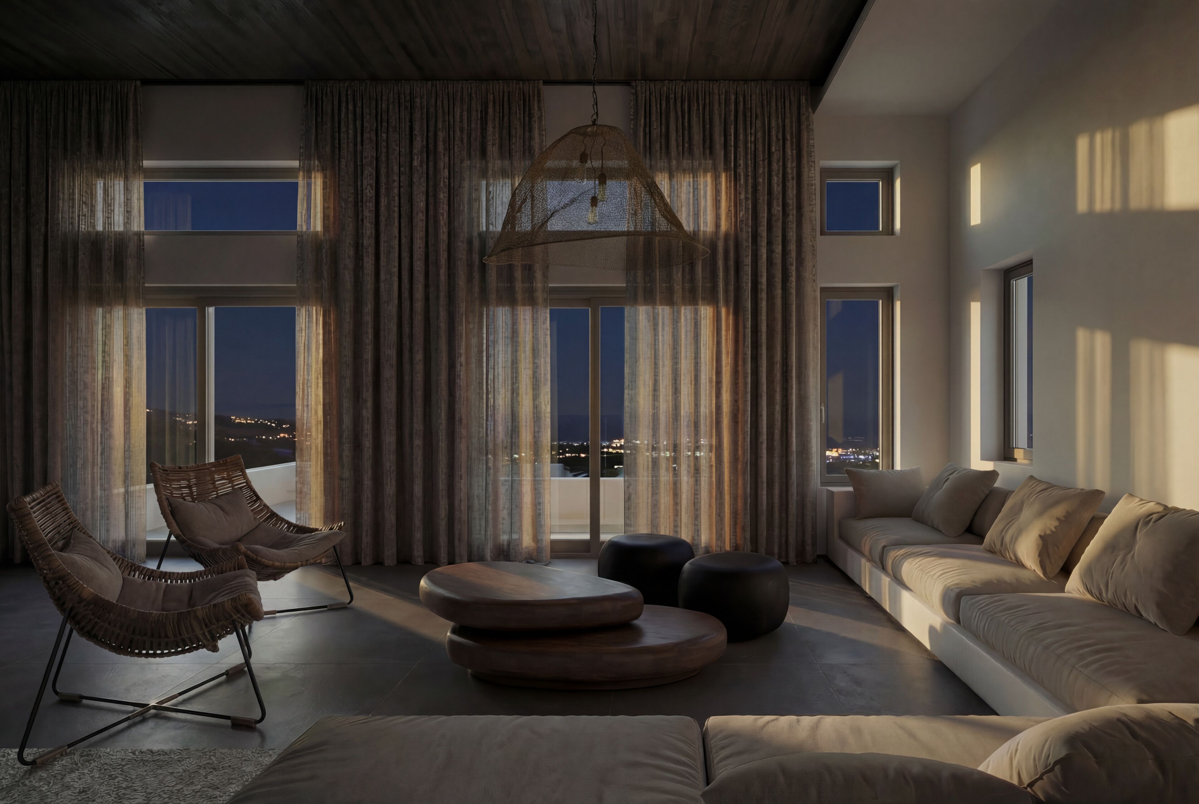 A modern living room with a sofa, two chairs, a round coffee table, and a large window with curtains.