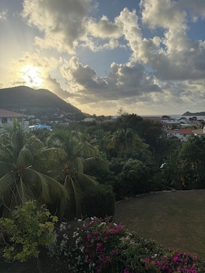 A landscape with a mountain, palm trees, and buildings in the distance. - 5BR Rodney Bay Villa. Walk to Beach, Dining & Nightlife. Sleeps 10 (Gros Islet)