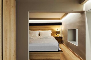 A modern bedroom with a wooden headboard, a bedside table with a lamp, and a built-in shelf. - Chrysma Urban Living 2, Apartment (Rhodes)